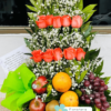 arreglo de flores con frutas